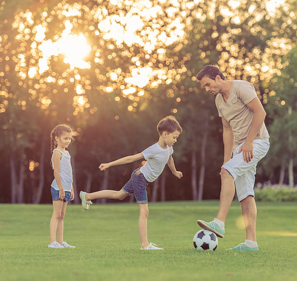 istock Family playing soccer 598783054