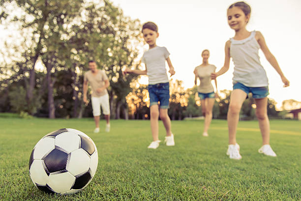 istock Family playing soccer 598783088