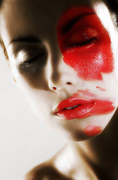 istock woman beauty with red makeup 598783234