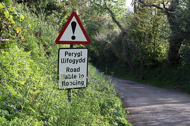 istock warning sign for flooded road 598783344