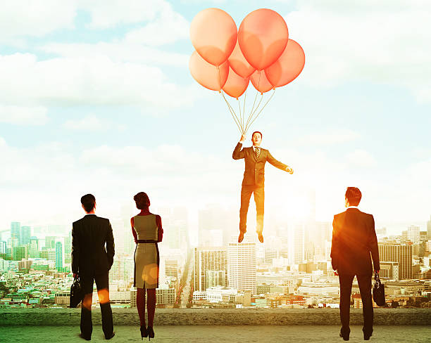istock flying balloons with Businessman 598783586