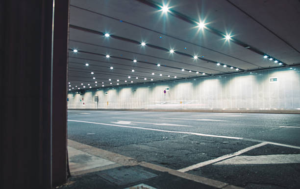 istock Fast cars in a modern tunnel by night 598784198