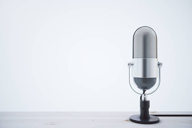 mic on light wooden table - dynamic microphone imagens e fotografias de stock