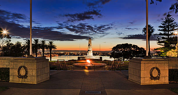 PERTH Obelisk Blue Rise ANZAC memorial obelist in Kings Park of the city of Perth at sunrise during blue hour. Swan river flows in background behind stone column, rememberance fire and water pool. kings park stock pictures, royalty-free photos & images