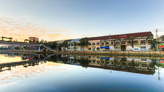 Ho Chi Minh City, Vietnam - September 2, 2014: Binh Dong wharf on Tau Hu canal at Ho Chi Minh City, Vietnam in the sunrise or sunset. This is also called Saigon old town with many old houses