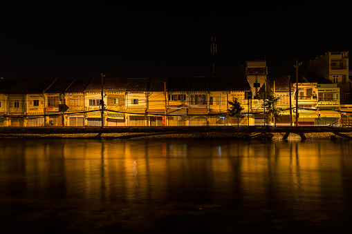 Ho Chi Minh City, Vietnam - September 4, 2014: Binh Dong wharf on Tau Hu canal at Ho Chi Minh City, Vietnam at night. This is also called Saigon old town with many old houses