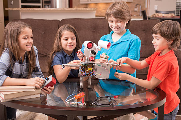 istock Children build robot together at home. 598789718