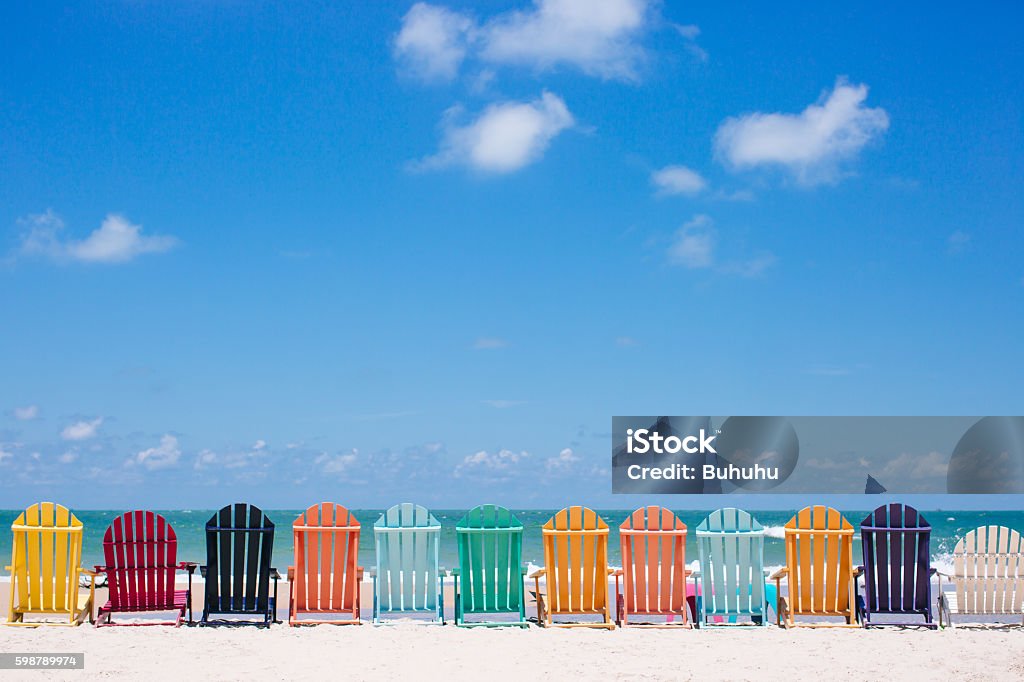 Beautiful color chairs on the beach Beautiful color chairs on the beach on the summer vacation Summer Stock Photo