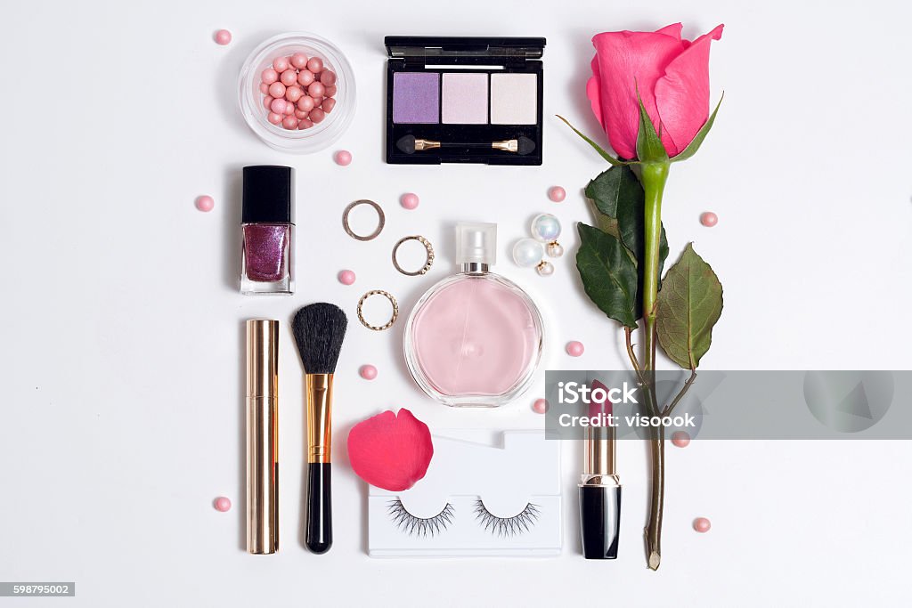 Still life of fashion woman. Set of decorative cosmetic Still life of fashion woman. Set of decorative cosmetic make up with perfume and rose . Top view Make-Up Stock Photo