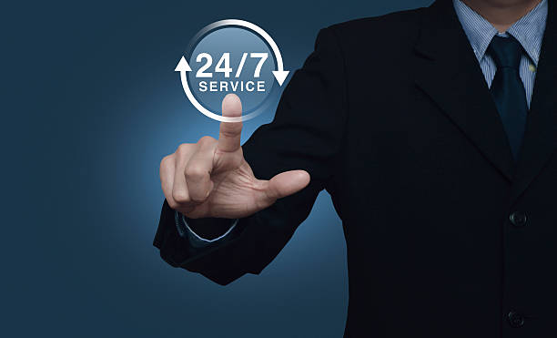 istock Businessman pressing button 24 hours service icon on blue background 598796504