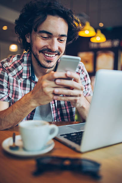 istock Man with smart phone and laptop 598796712