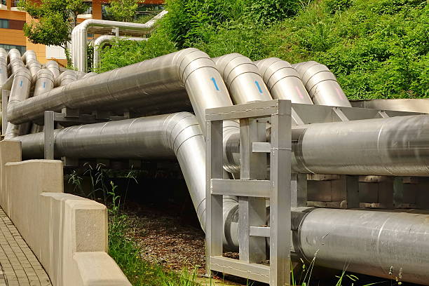 istock Big Silver Heat Supply Pipeline Connected To Building 598798390