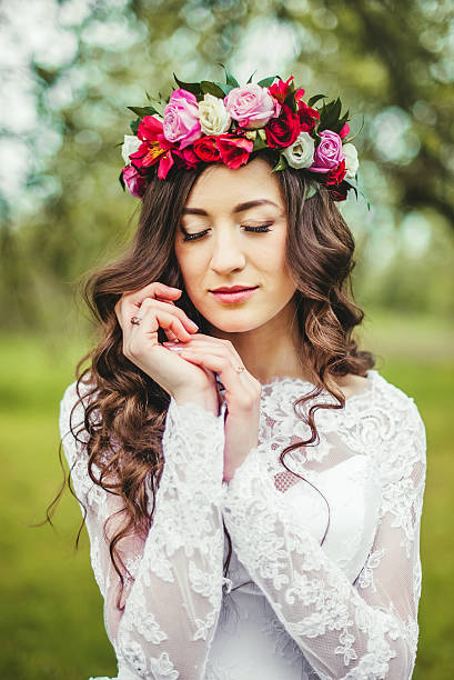 istock Bride in white dress in a garden 598798958