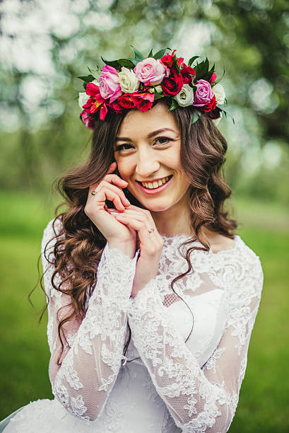 istock Bride in white dress in a garden 598799190