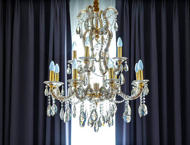 istock shining chandelier and curtain 598800784