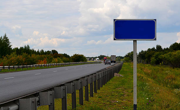 istock Road blue sign on a road course. 598800804
