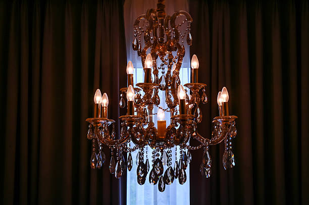 istock shining chandelier and curtain 598800832