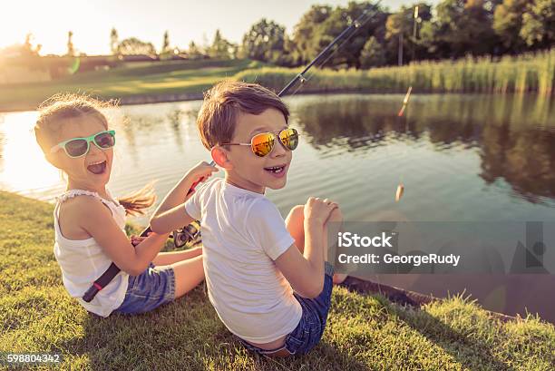 Kids Catching Fish Stock Photo - Download Image Now - Child, Fishing, Summer