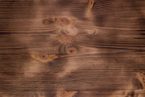 istock Warm brown (burned and brushed) wooden natural background 598805978