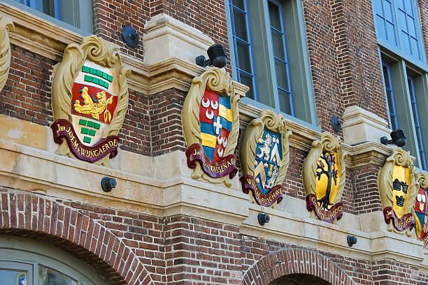 istock Old building with coat of arms on facade 598808250