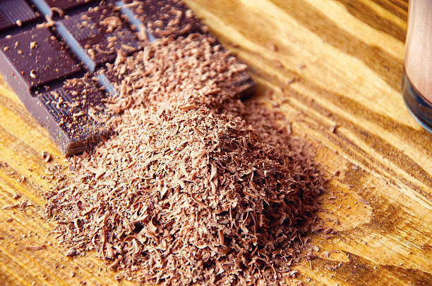 istock Cubes of chocolate and grated chocolate 598809134