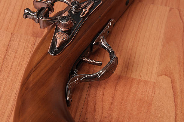 istock Vintage pistols on wooden background 598809534