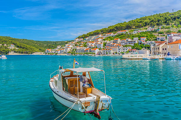 Island Brac Pucisca seascape. Waterfront view at small picturesque town Pucisca, Island of Brac, Croatia summertime.  adriatic sea photos stock pictures, royalty-free photos & images