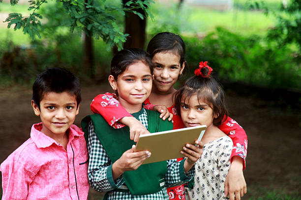istock Rural children holding digital tablet 598811586