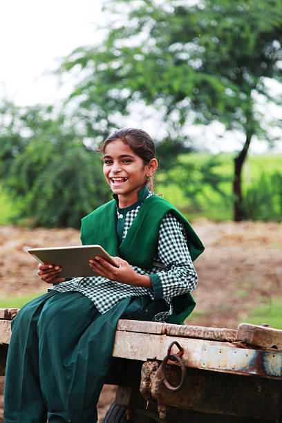 istock Cheerful student girl holding digital tablet 598812050