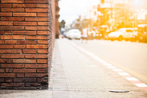 Orange brick wall with traffic in sunset, Chiang Mai Thailand
