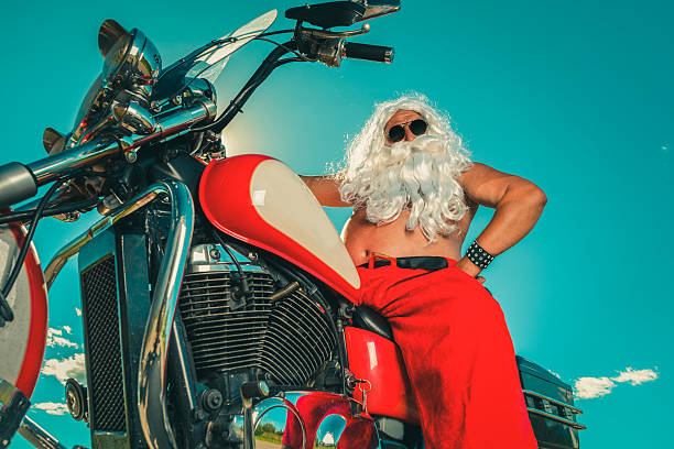 santa na motocyklu - old senior adult one person rudeness zdjęcia i obrazy z banku zdjęć