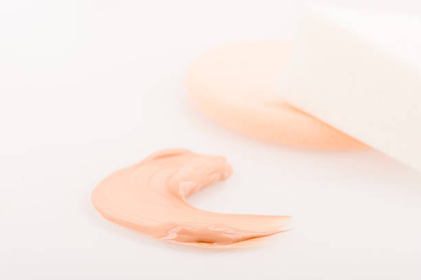 istock Liquid tinted make-up cream foundation sample stroke and sponges 598815852