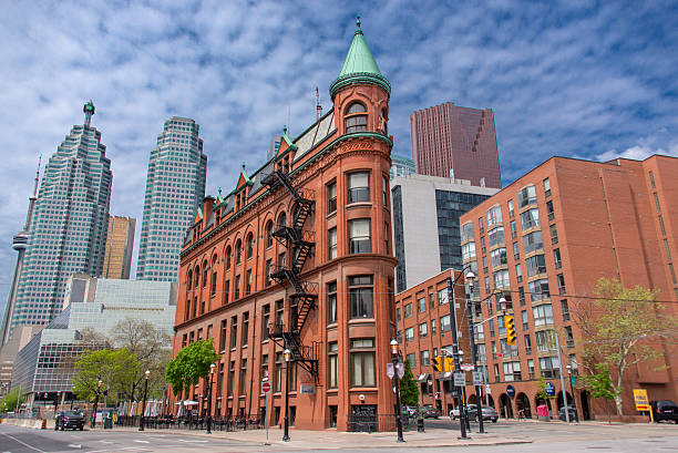Downtown Toronto City view of the Gooderham Building or Flatiron Building and financial district of Toronto. At the left side the CN Tower can be seen partially. flatiron building toronto stock pictures, royalty-free photos & images