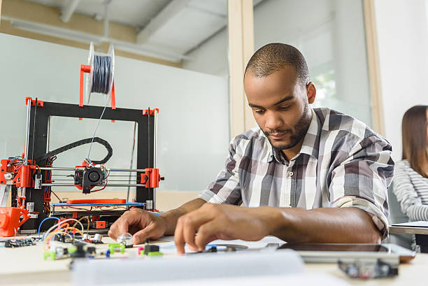 istock Clever male engineer designing three dimensional printing machine 598818854