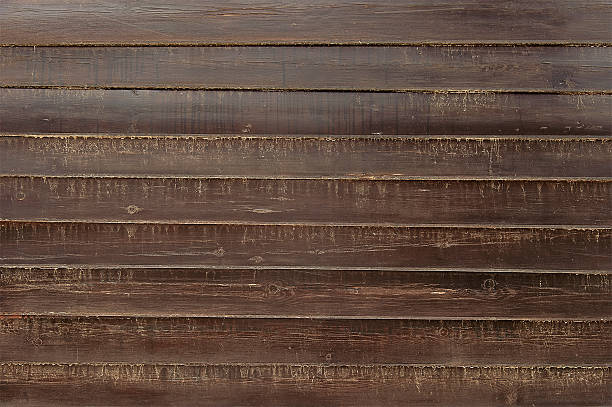 istock Old dark brown wooden fence background texture 598818956