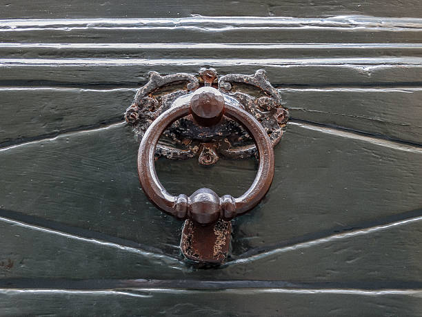 istock Knocker in old green door 598819172