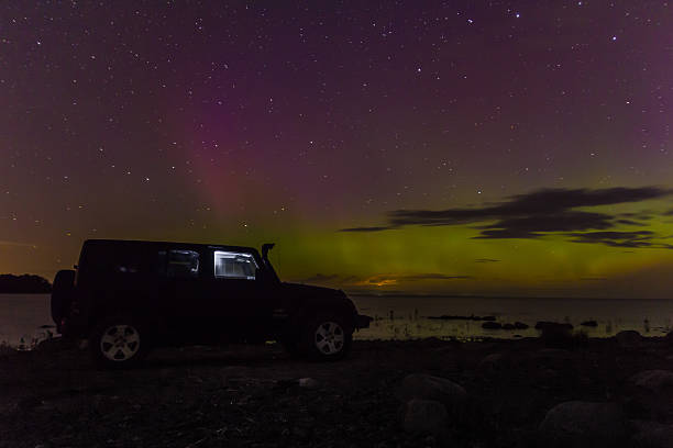 jeep wrangler on the shore of lake ladoga - editorial sports utility vehicle car jeep imagens e fotografias de stock