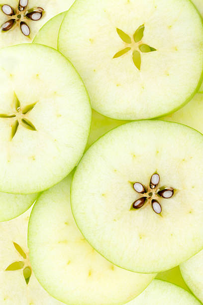 istock Conceptual background pattern and texture of sliced apples 598821658