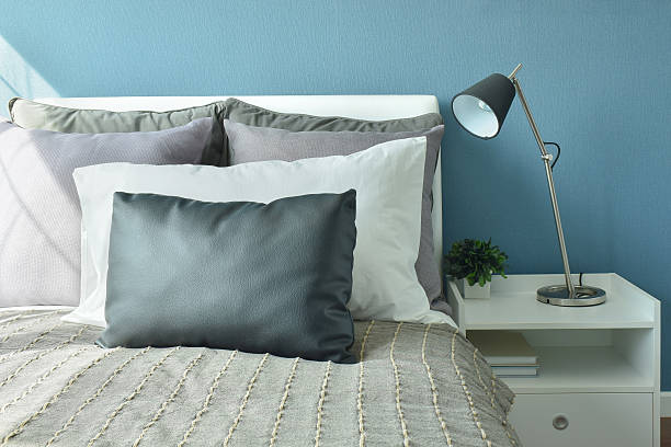 istock Gray, black and white pillows on bed with modern style 598821962