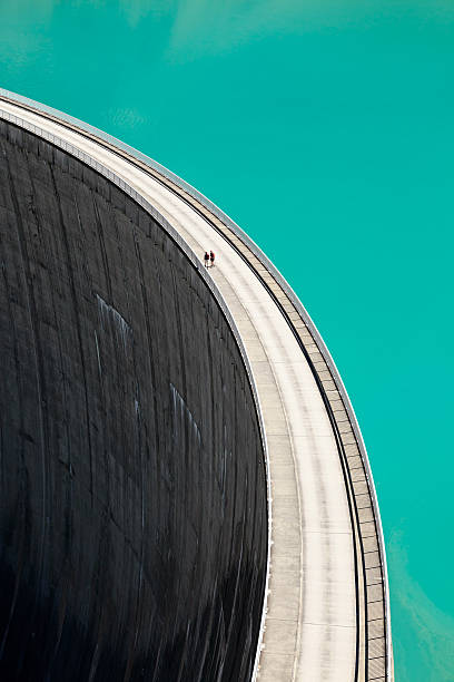 istock People walking on edge of Stausee Mooserboden Dam, Kaprun, Austria 598824220