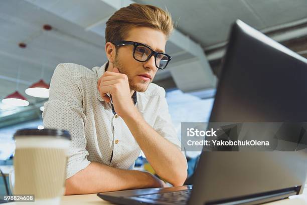 Super Smart Computer Guy Smart Guy Working On Computer In Cafe Stock Photo - Download Image Now ...