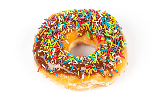 istock Sprinkled Chocolate Iced Donut Isolated 598826854