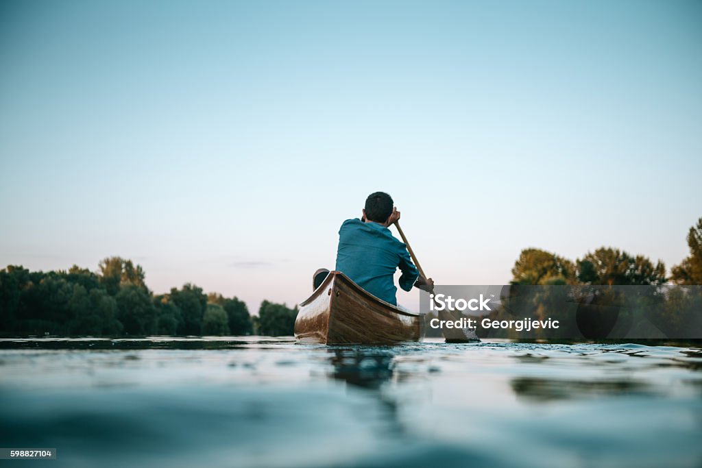 Out for a leisurely boat ride Couple enjoying a boat ride on the lake. Adult Stock Photo