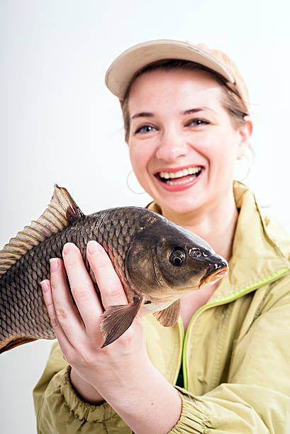 istock Happy woman with carp 598827934
