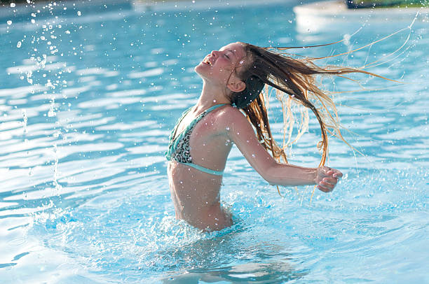 istock Ten years girl in pool 598828286