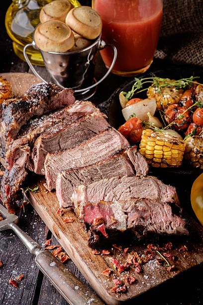 istock Grilled steak sliced on a cutting board. 598828722