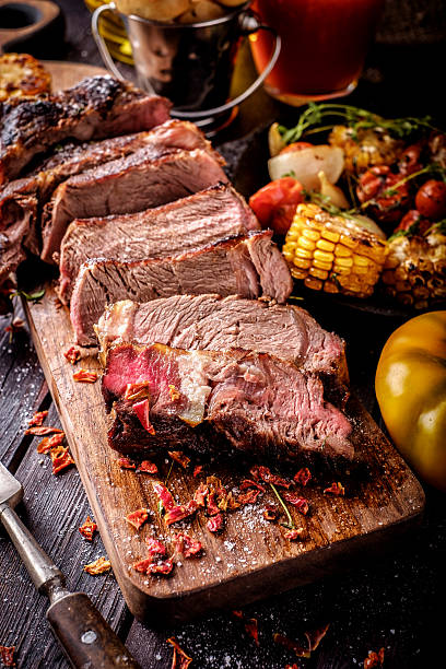 istock Grilled steak sliced on a cutting board. 598829016