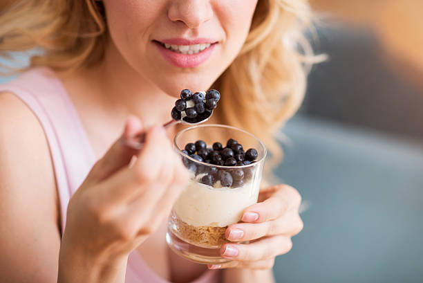 istock Sensitive young woman eating desert 598829858