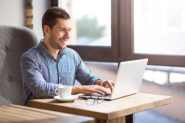 istock Positive smiling am sitting at the table 598829940