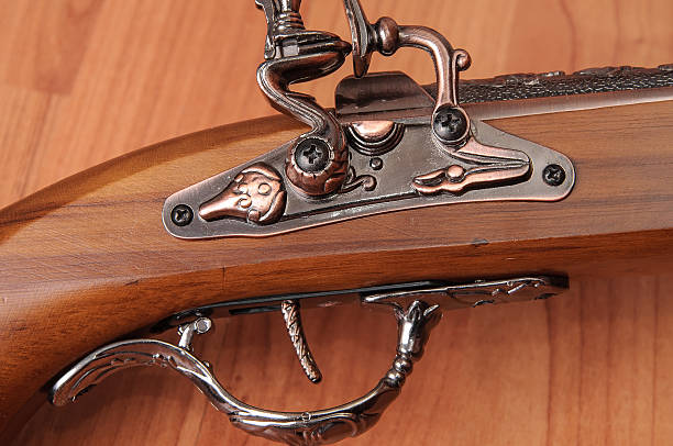 istock Vintage pistols on wooden background 598830292